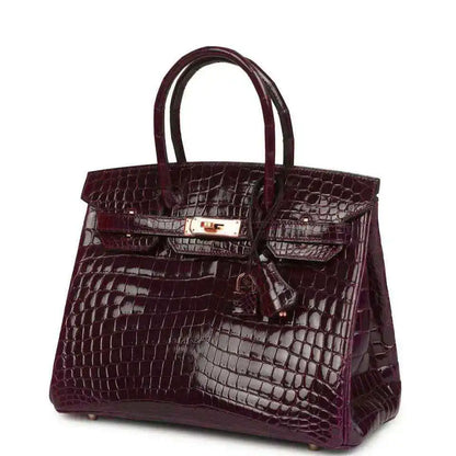 Hermes Birkin 30 bag, bordeaux glossy crocodile leather with gold-tone front latch detail