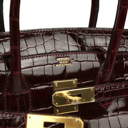 Hermes Birkin 30 bag interior, Hermes stamp and gold-tone lock hardware on croc lining