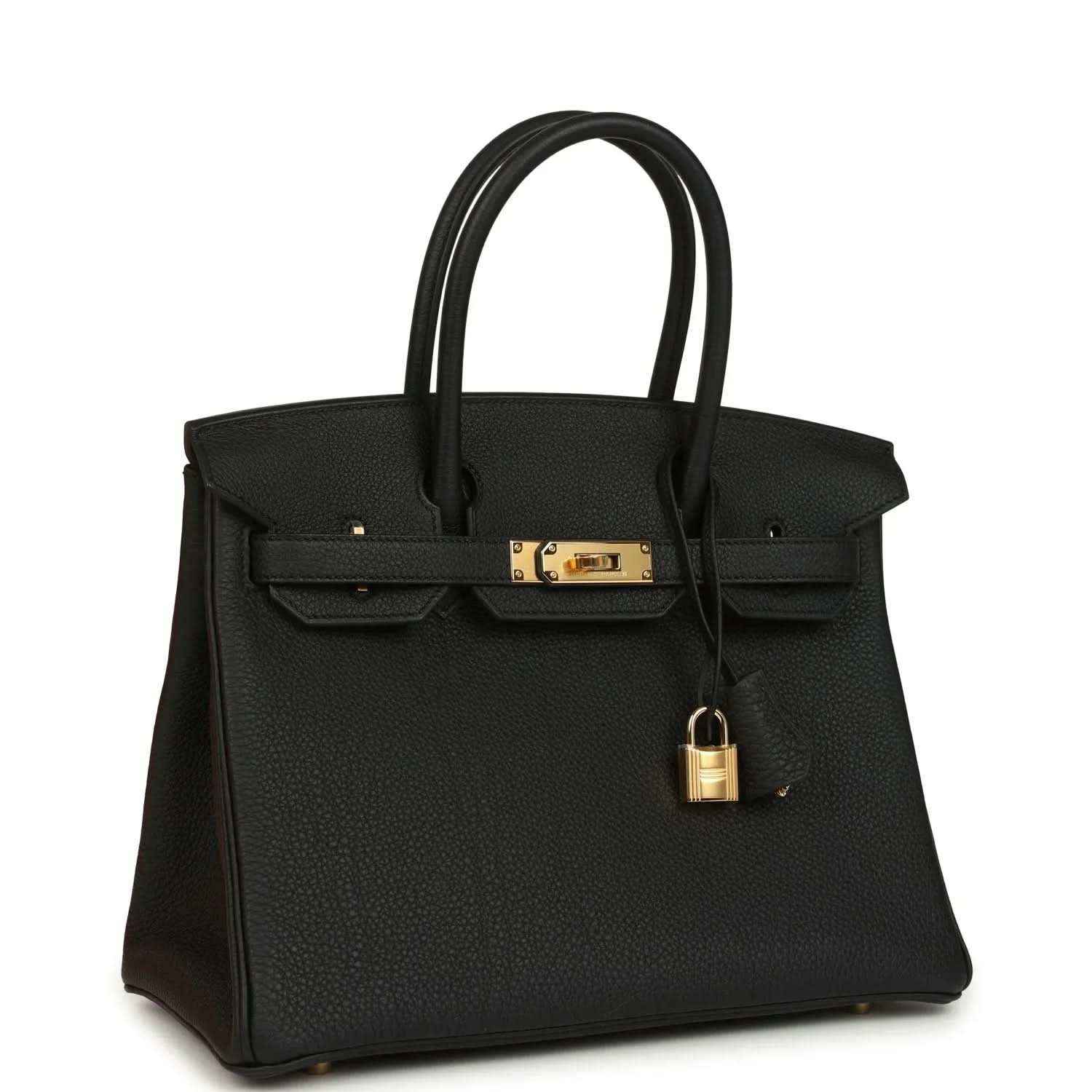 Black leather handbag with top handles, front flap, and gold lock hardware