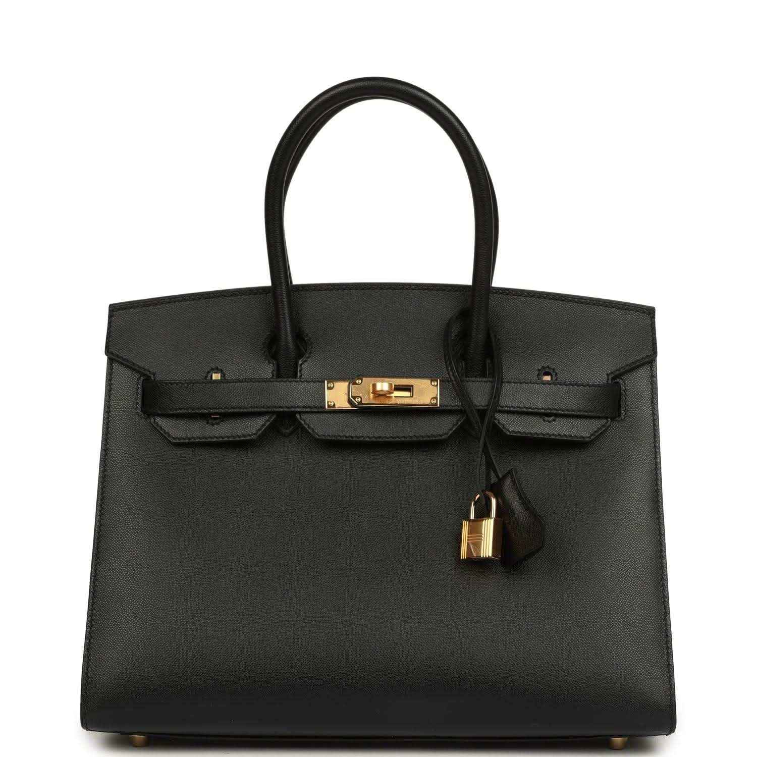 Black leather Birkin-style handbag with gold front clasp and hanging lock charm