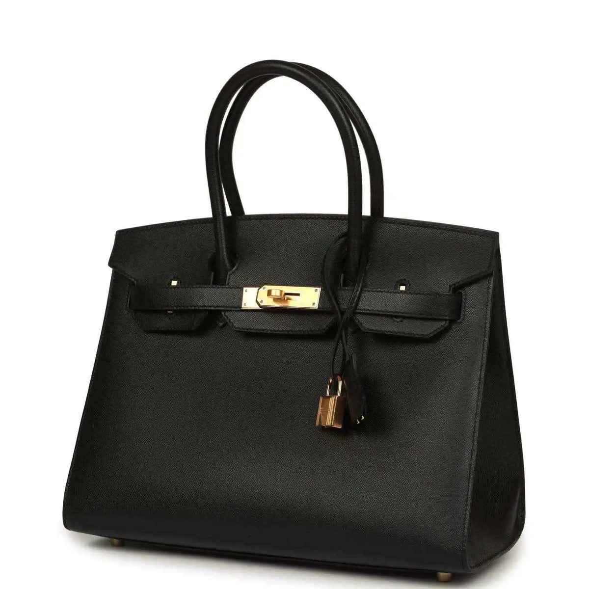 Black leather handbag with top handles, gold front clasp, and hanging tassel