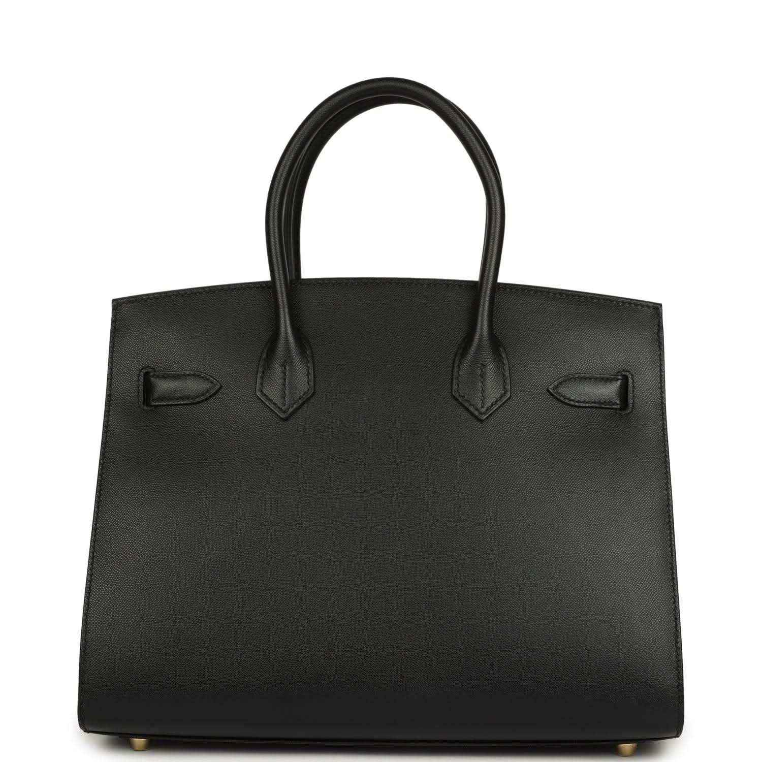 Black leather handbag with two top handles and front patch pockets