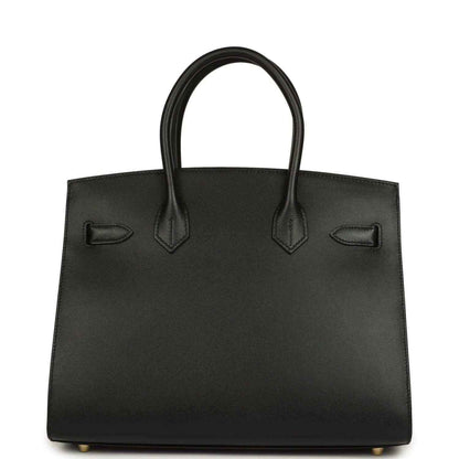 Black leather handbag with two top handles and front patch pockets
