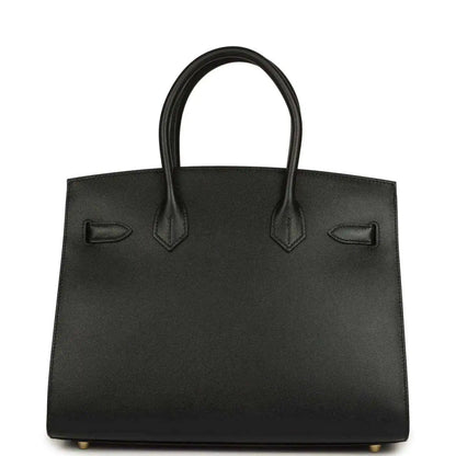Black leather handbag with two top handles and front patch pockets