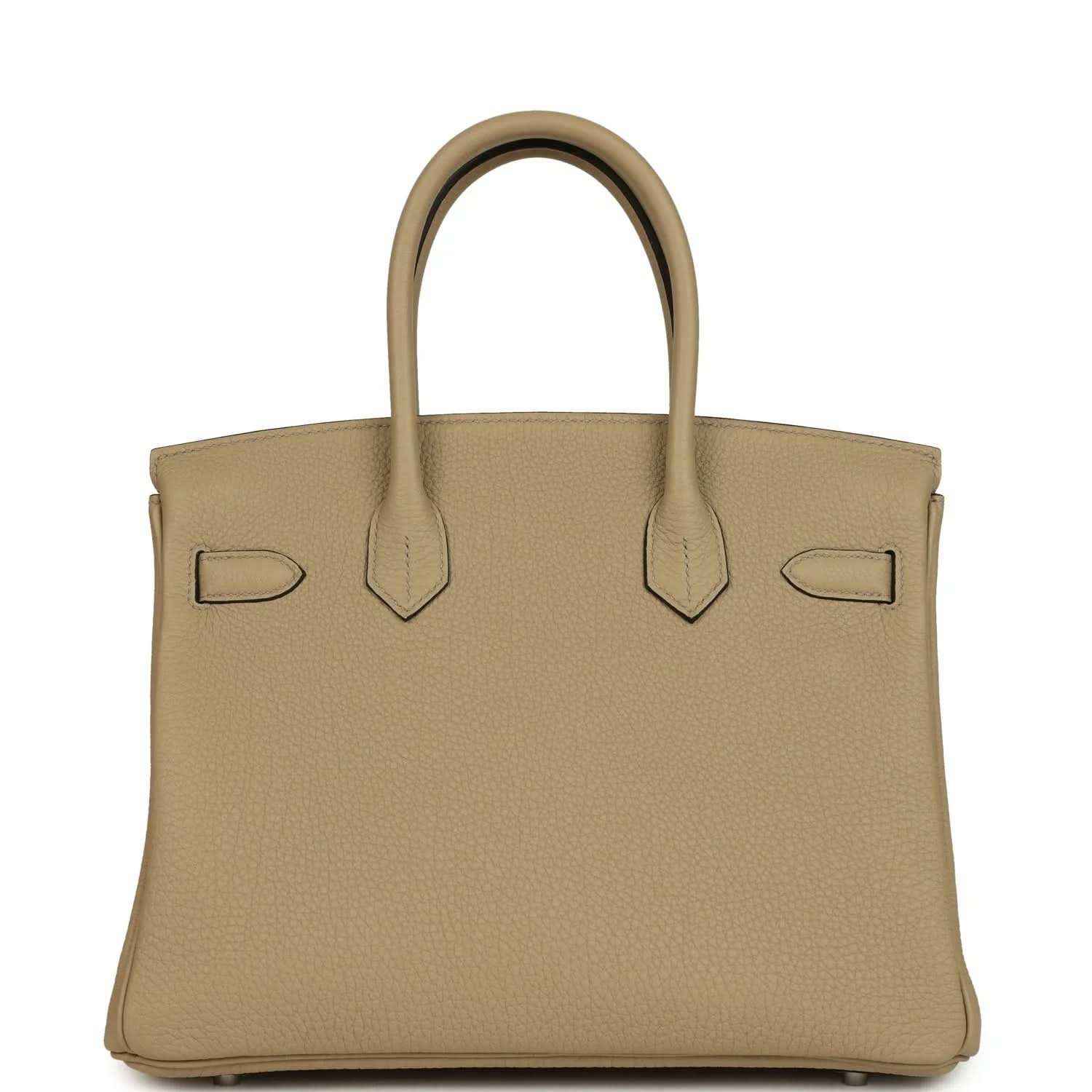 Tan leather handbag front view with flap, decorative straps, and polished lock bar
