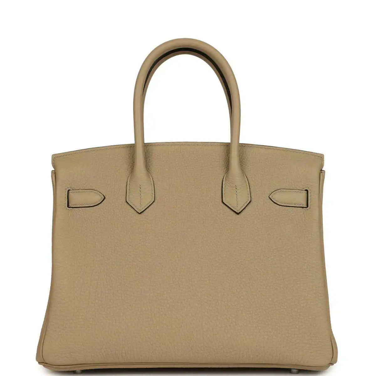 Tan leather handbag front view with flap, decorative straps, and polished lock bar