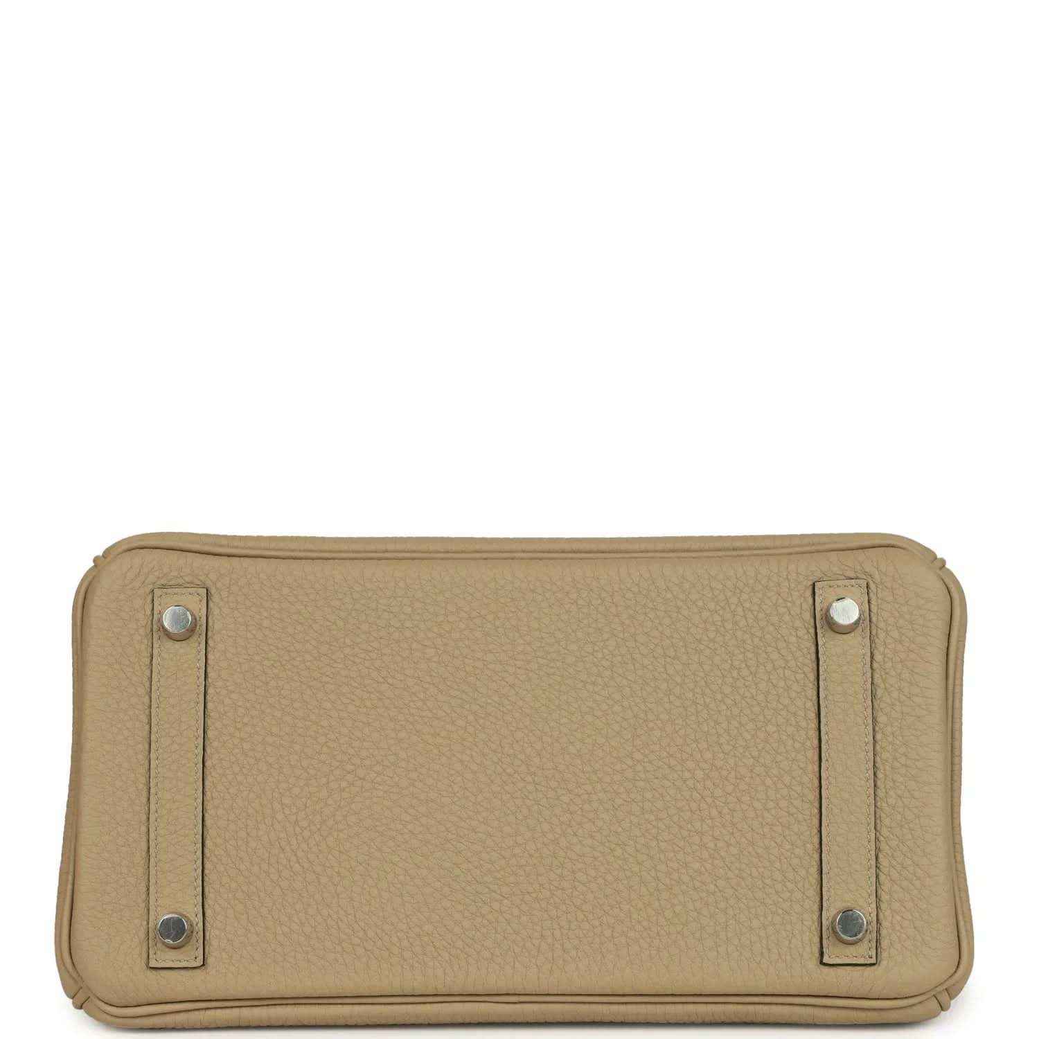 Tan leather handbag base view with reinforced corners and two side hardware tabs
