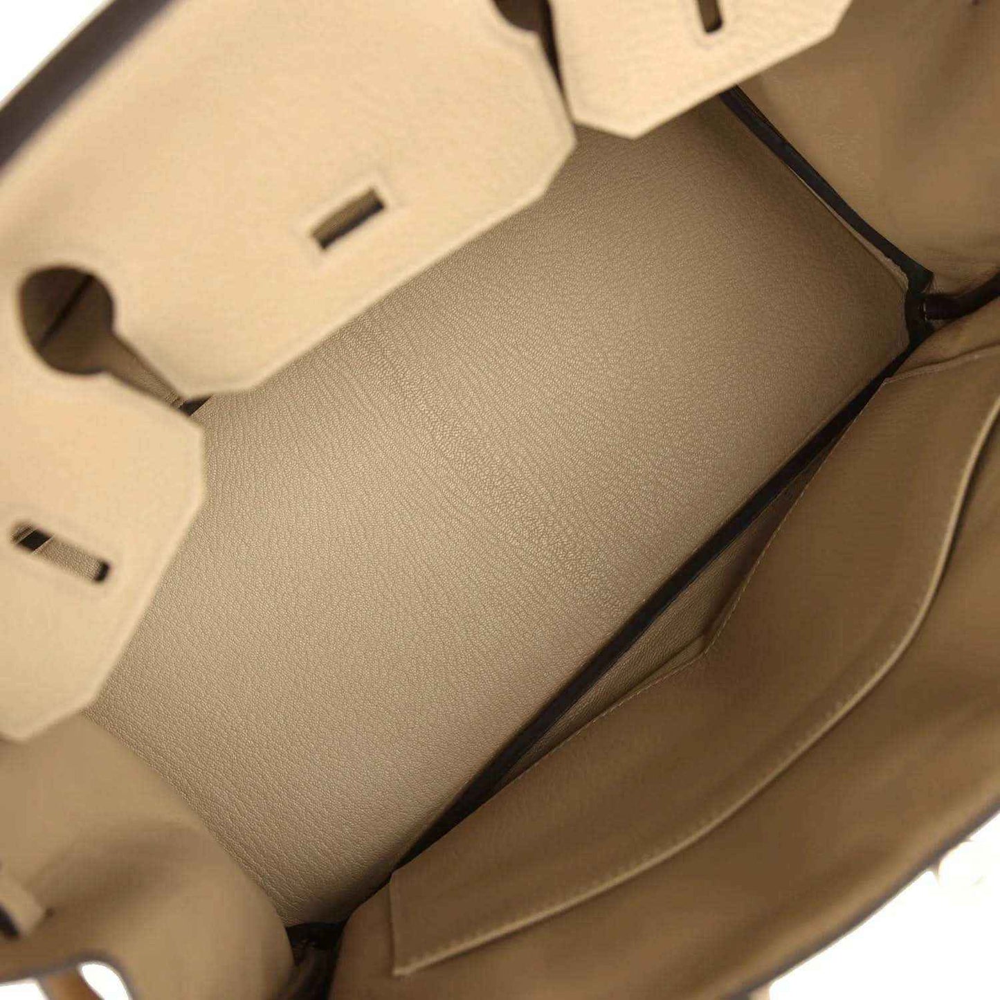 Tan leather handbag interior with stitched lining panels and side wall detail