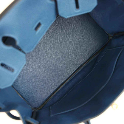 Hermes Birkin 30 blue Togo leather handbag close-up of textured base and seams