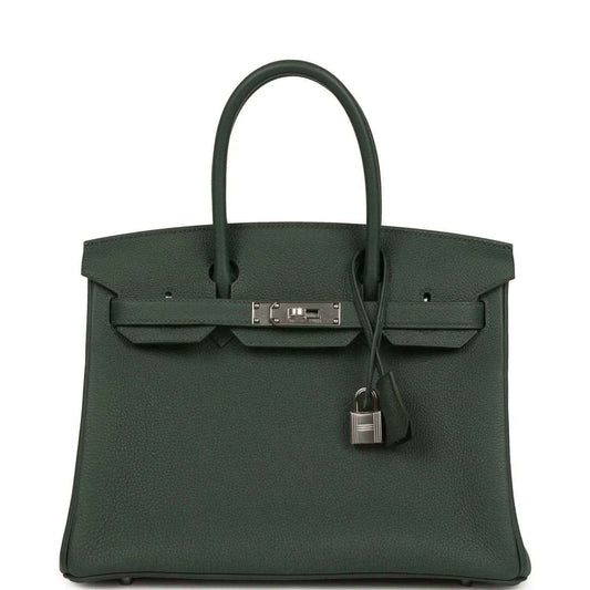 Green leather handbag with top handles, front flap and turn-lock with dangling padlock