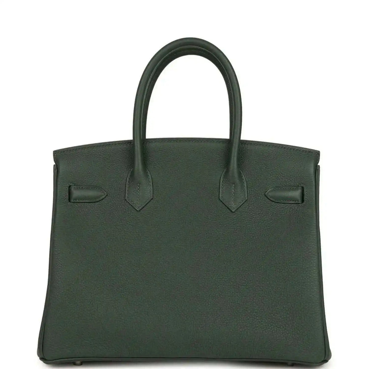 Green leather handbag with top handles and front flap details; decorative corner tabs