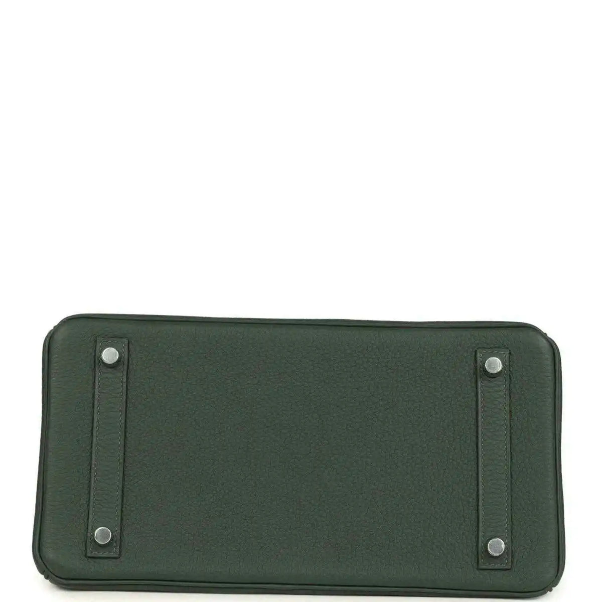 Green leather handbag base with stitched panels and four small metal feet