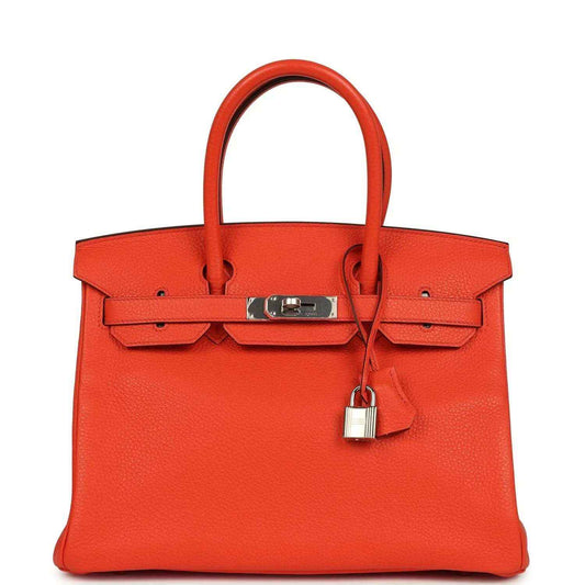 Orange Birkin handbag with textured Togo leather, top handles, and front belt lock