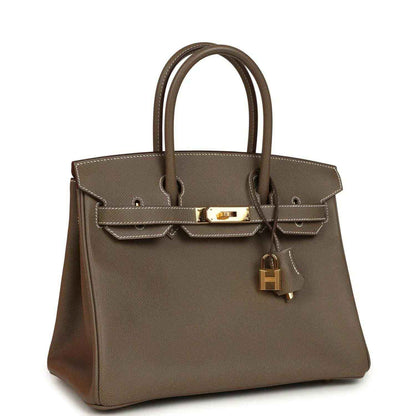 Etoupe leather Birkin 30 with gold-tone clasp, top handles, and hanging lock charm
