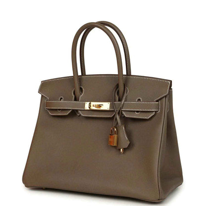 Etoupe leather Birkin 30 with gold-tone bar clasp, top handles, and lock charm