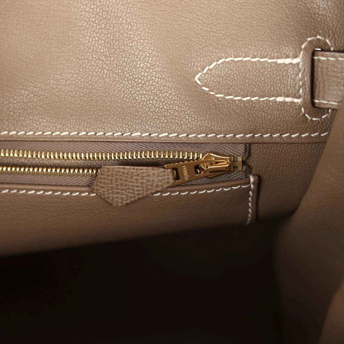 Etoupe leather Birkin 30 interior pocket with gold zipper pull and stitched trim