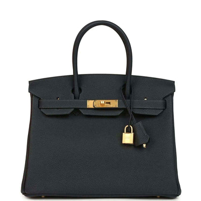 Hermes Birkin 30 leather handbag in dark with top handles and gold-tone lock