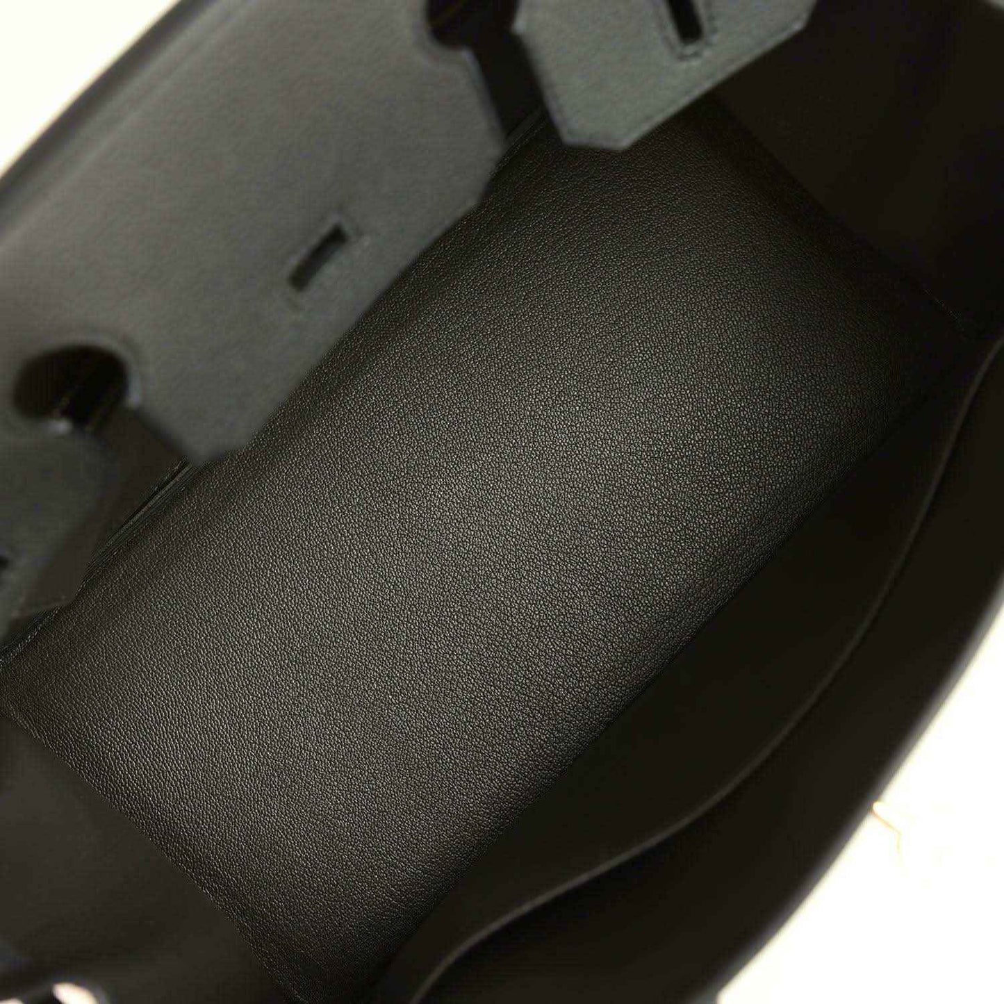 Dark green Togo leather interior panel with stitched edge
