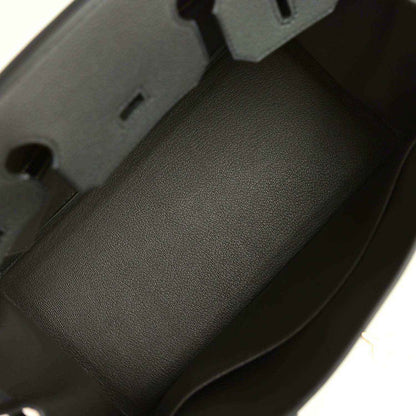 Dark green Togo leather interior panel with stitched edge