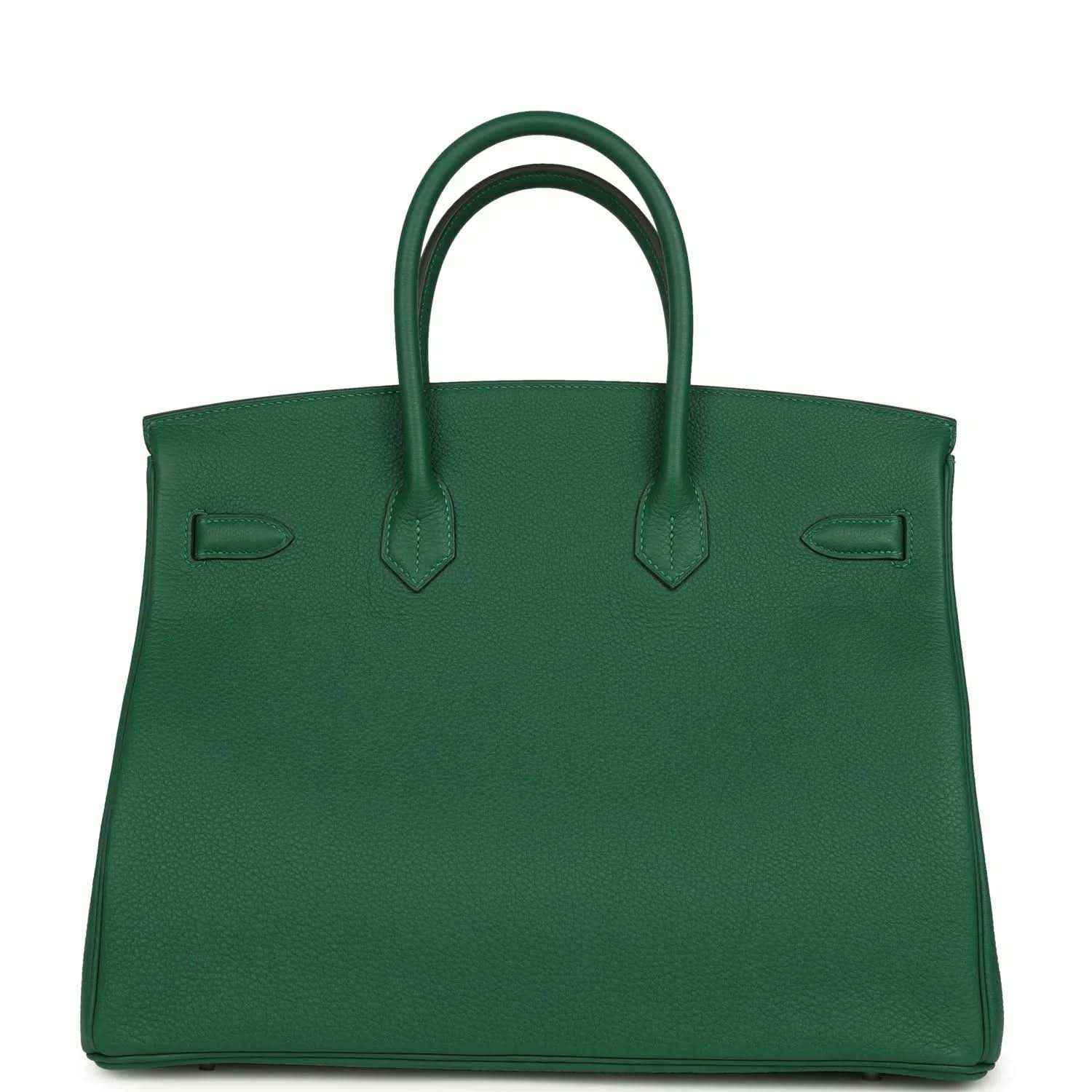 Green leather handbag with top handles and contrast stitching on front panels