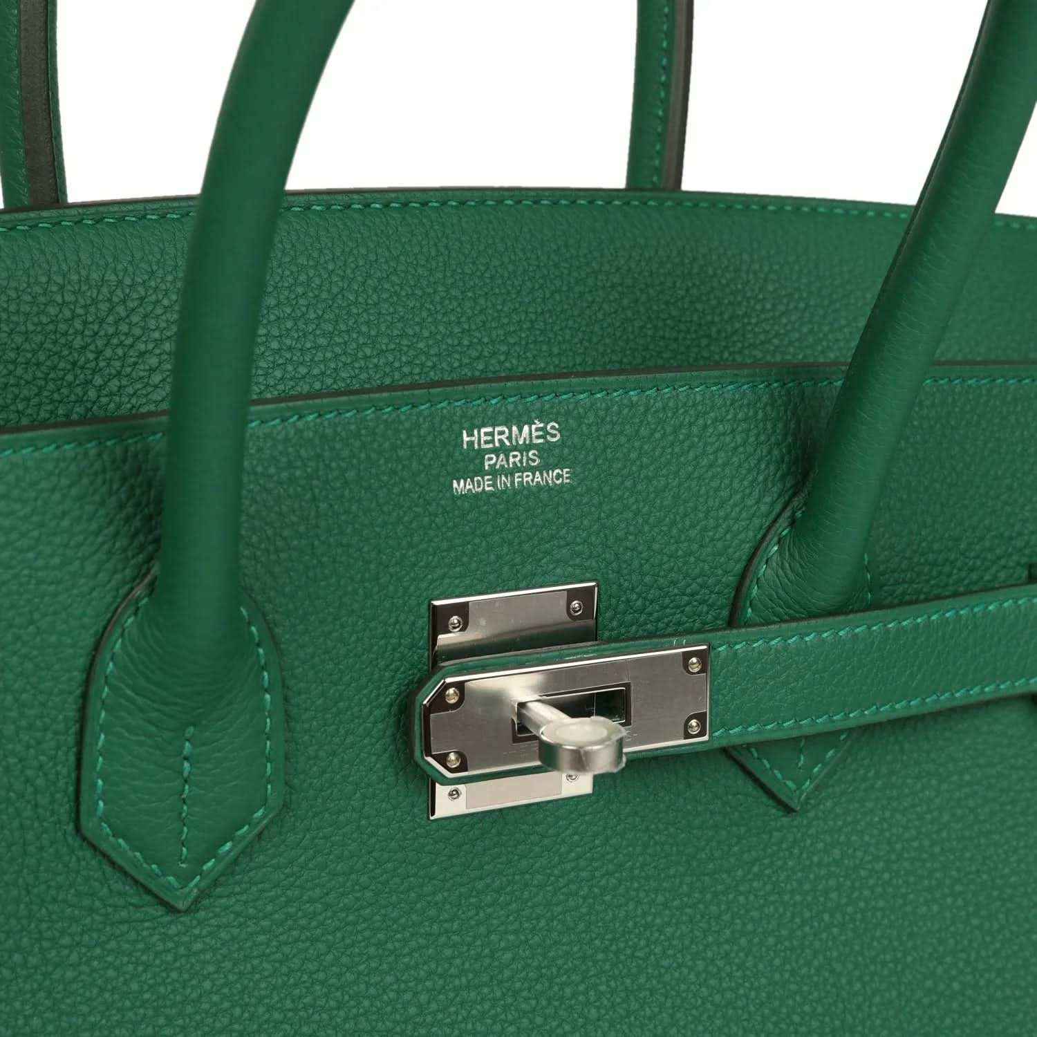 Green leather handbag with Hermes stamp and silver-tone front lock hardware