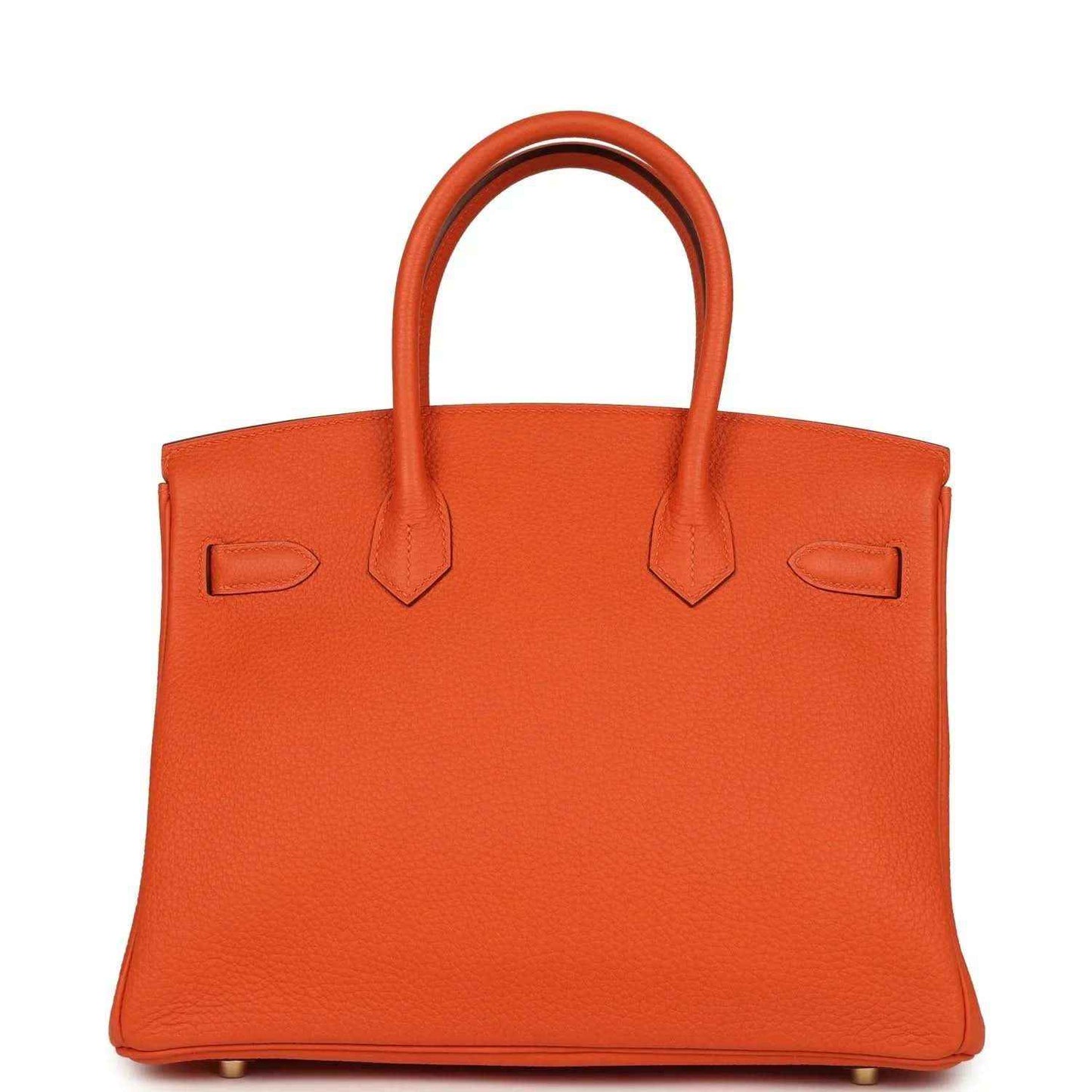 Orange leather handbag back view with two top handles and minimal front hardware.