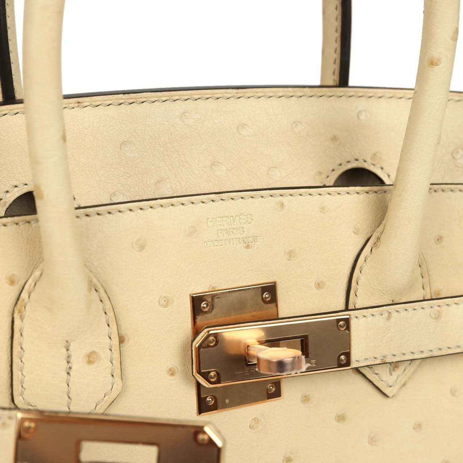 Hermes Birkin 30 front flap clasp close-up with rose gold tone hardware and stitching
