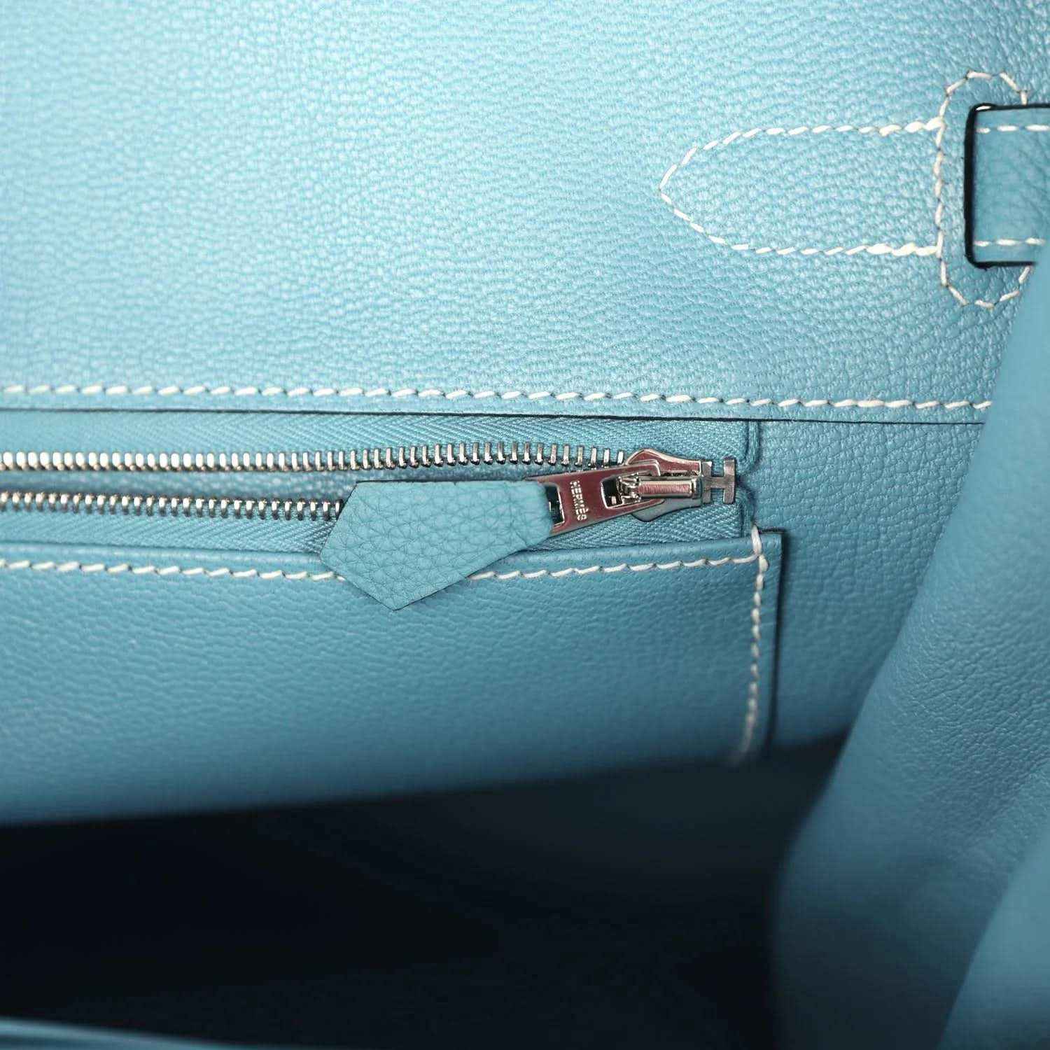 Turquoise leather zip pocket with palladium zipper pull and stitched interior panel