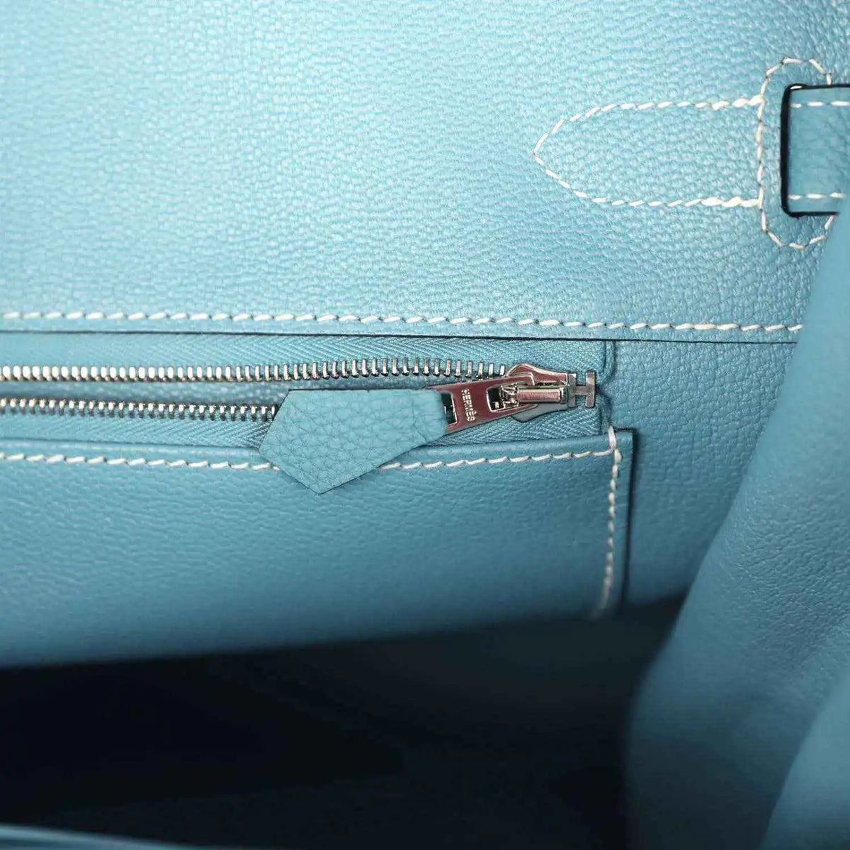 Turquoise leather zip pocket with palladium zipper pull and stitched interior panel