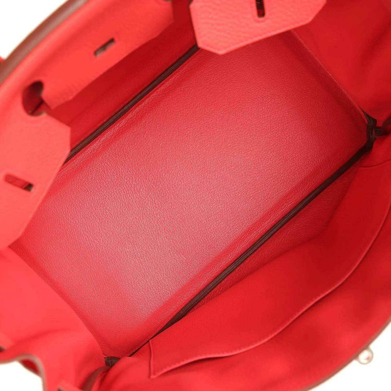 Red leather handbag interior with smooth lining and front partition seam
