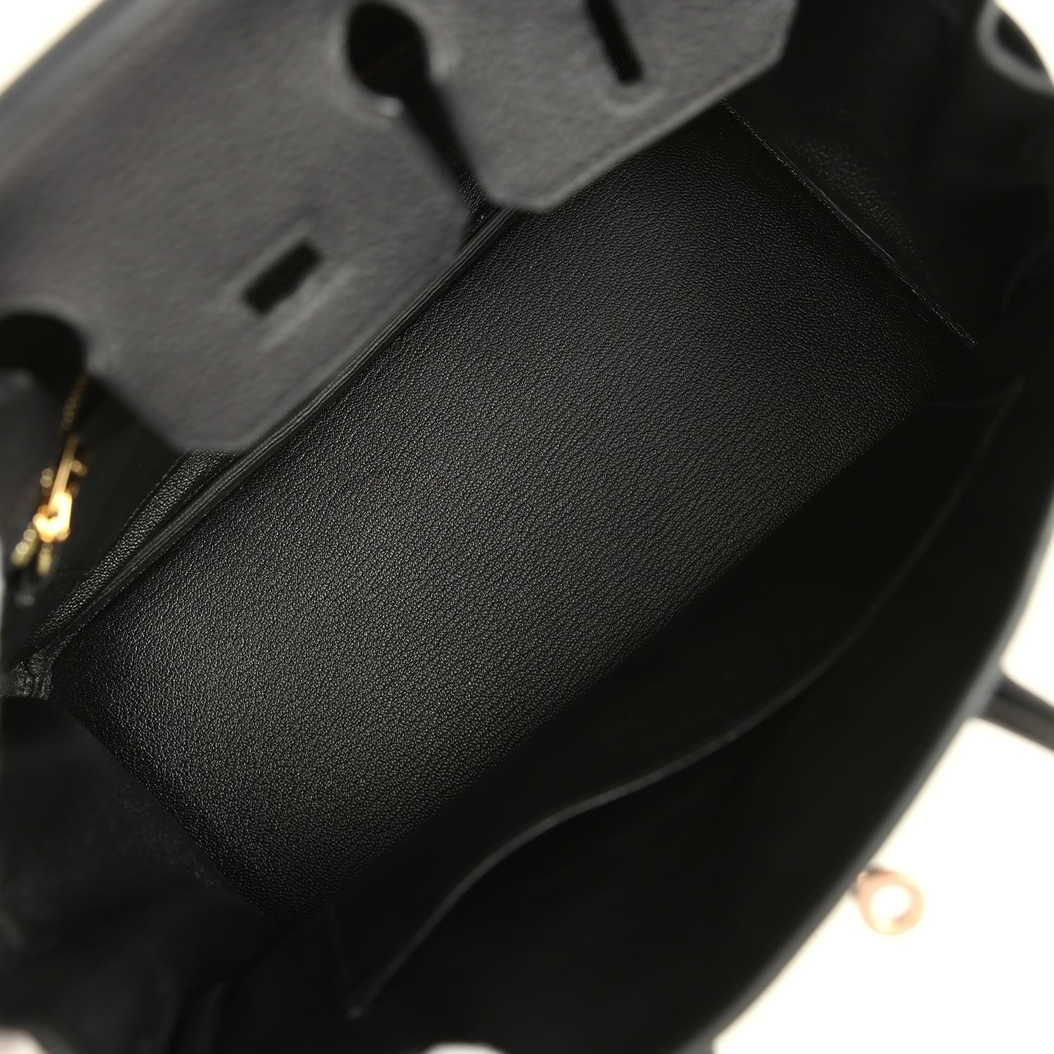 Black leather Birkin 25 handbag interior with dark fabric lining and side seam