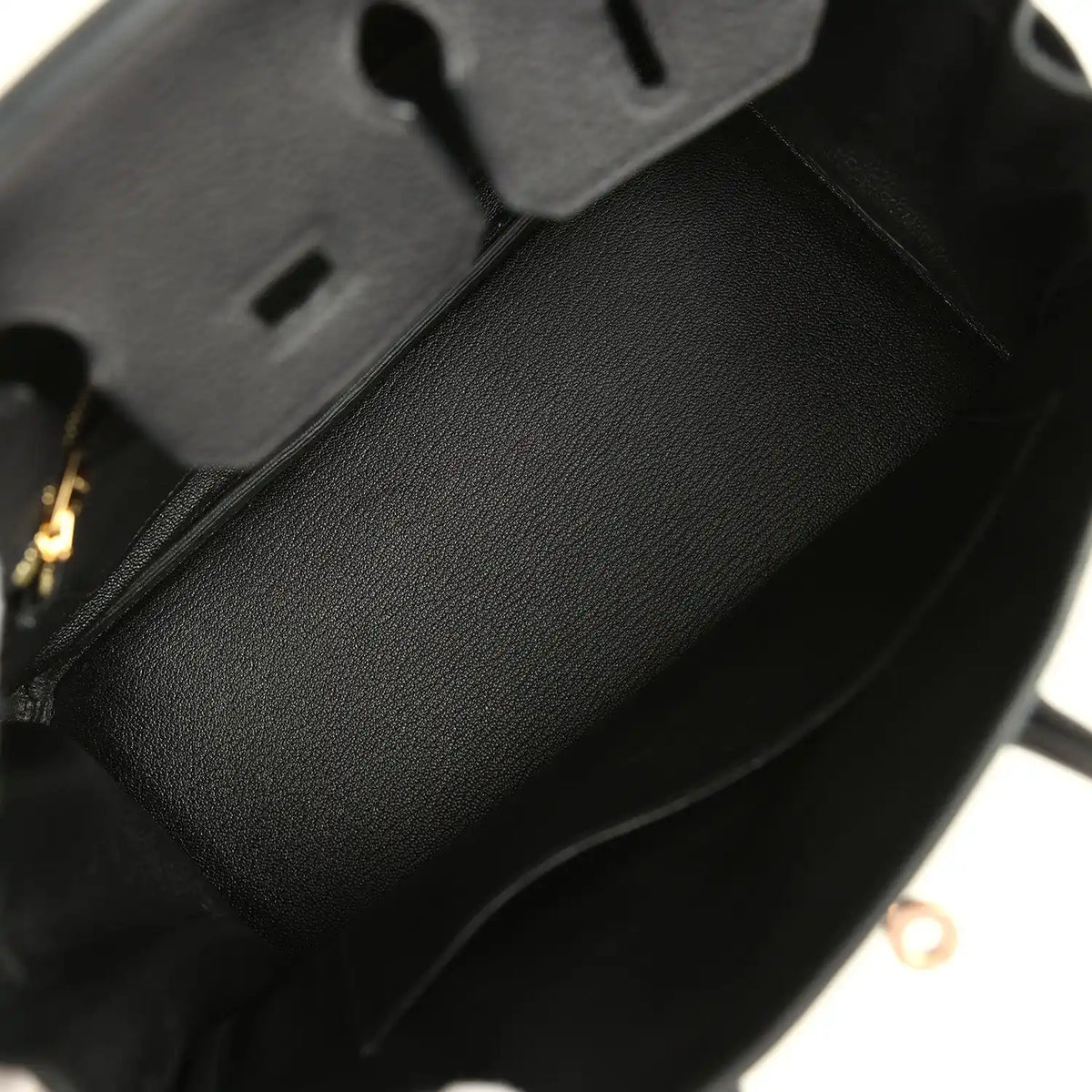 Black leather Birkin 25 handbag interior with dark fabric lining and side seam