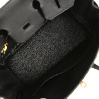 Black leather Birkin 25 handbag interior with dark fabric lining and side seam