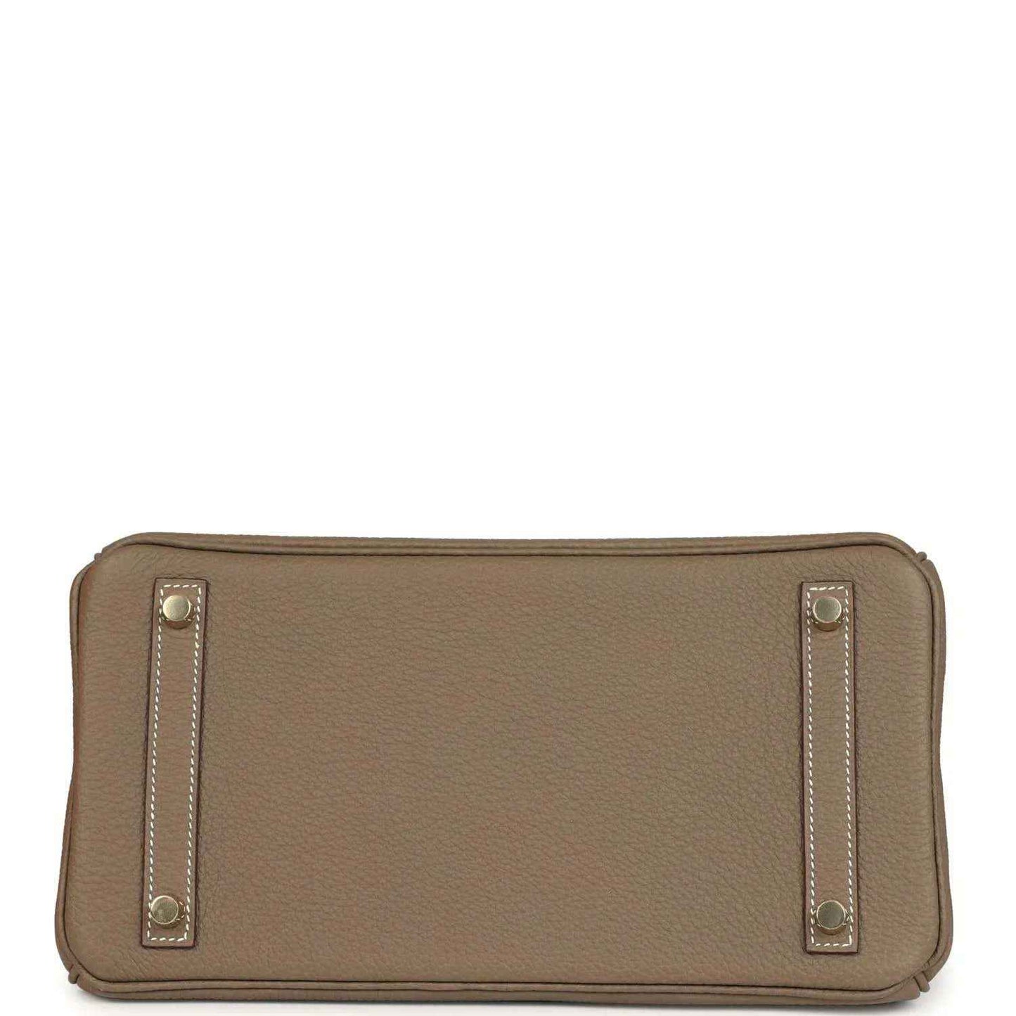 Hermes leather bag clasp close-up with gold plate and 'Hermes Paris' stamp