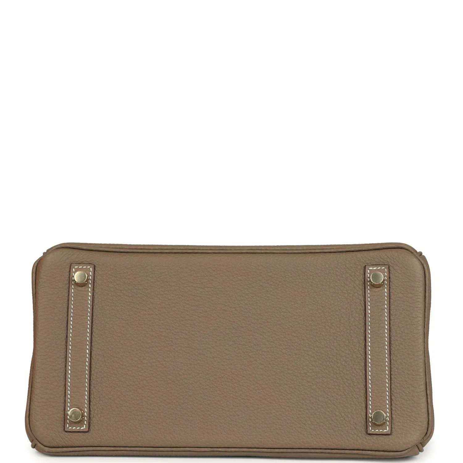 Hermes leather bag clasp close-up with gold plate and 'Hermes Paris' stamp