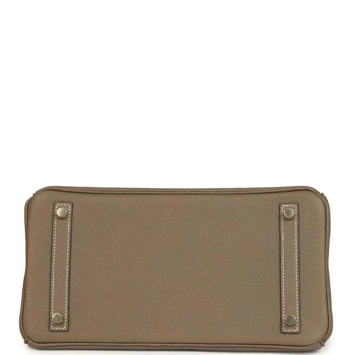 Hermes leather bag clasp close-up with gold plate and 'Hermes Paris' stamp