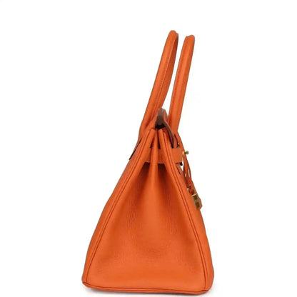 Hermes Birkin 30 orange Togo leather bag side view with top handles and seams