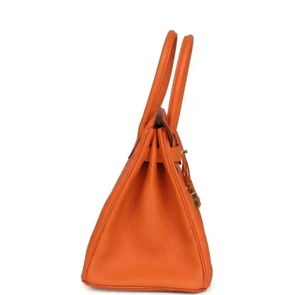 Hermes Birkin 30 orange Togo leather bag side view with top handles and seams