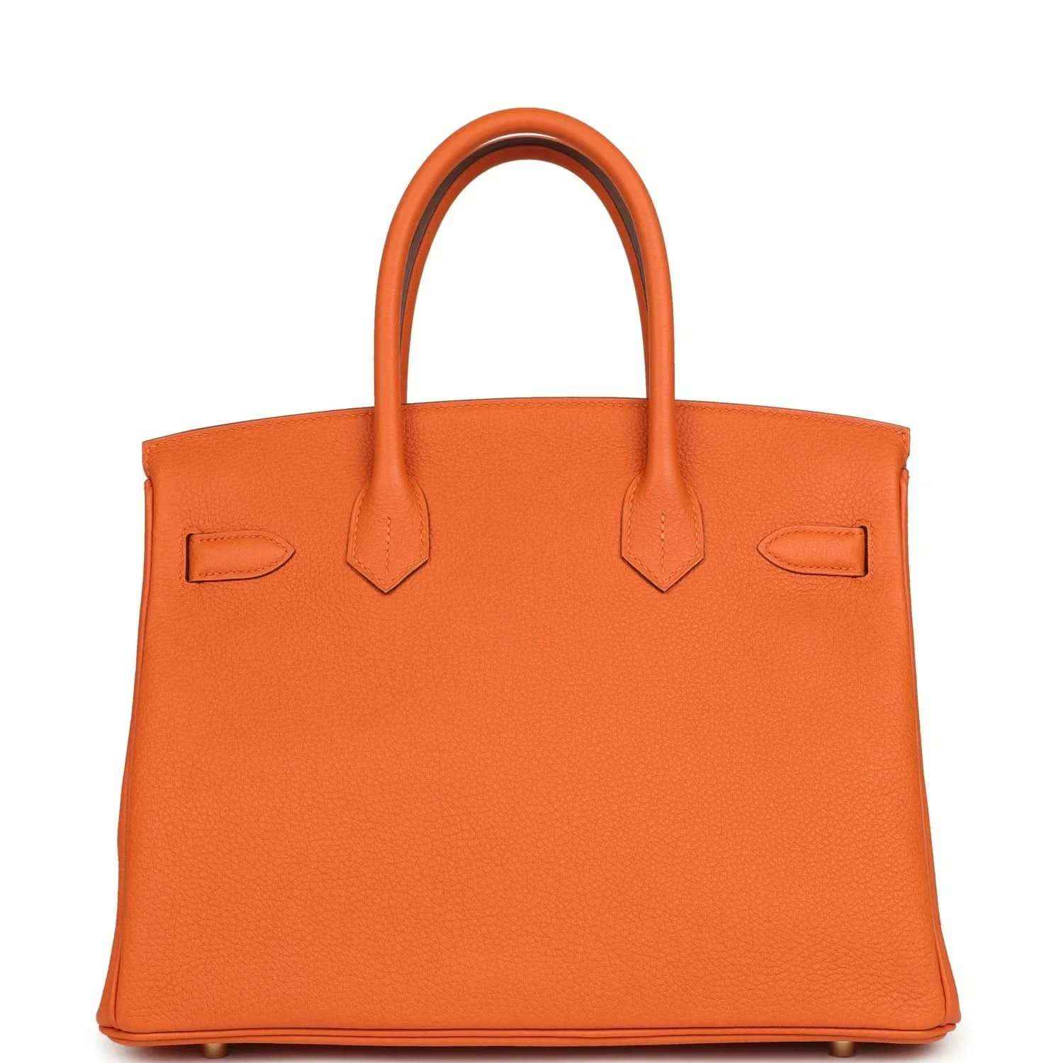 Hermes Birkin 30 orange Togo leather bag front with straps, flap pockets, and stitching