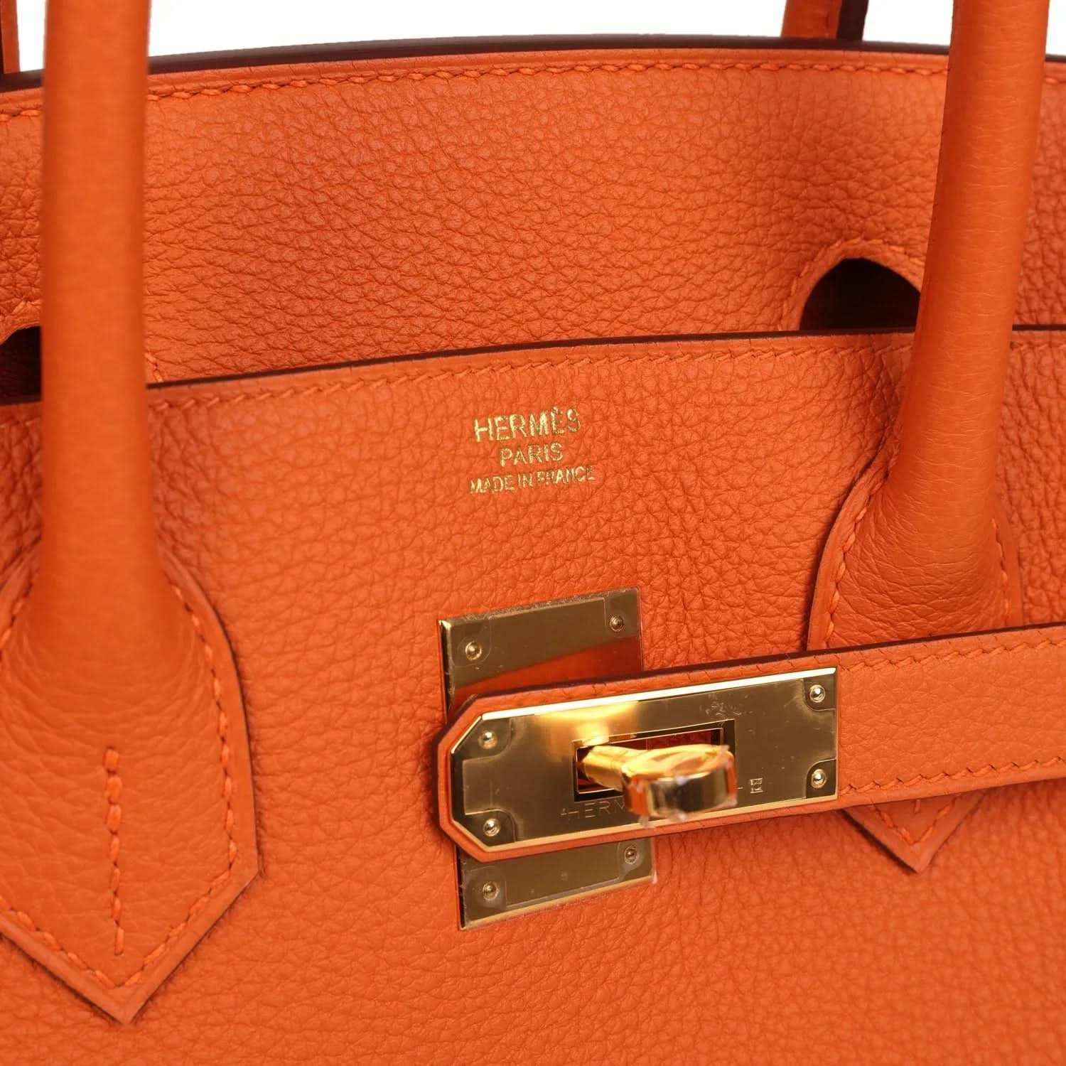 Hermes Birkin 30 orange leather interior with gold-tone lock and “Hermes Paris” label