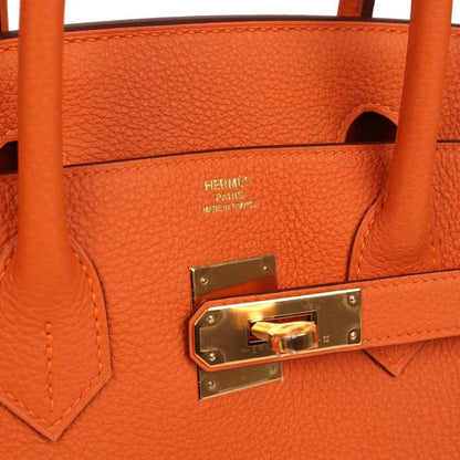 Hermes Birkin 30 orange leather interior with gold-tone lock and “Hermes Paris” label