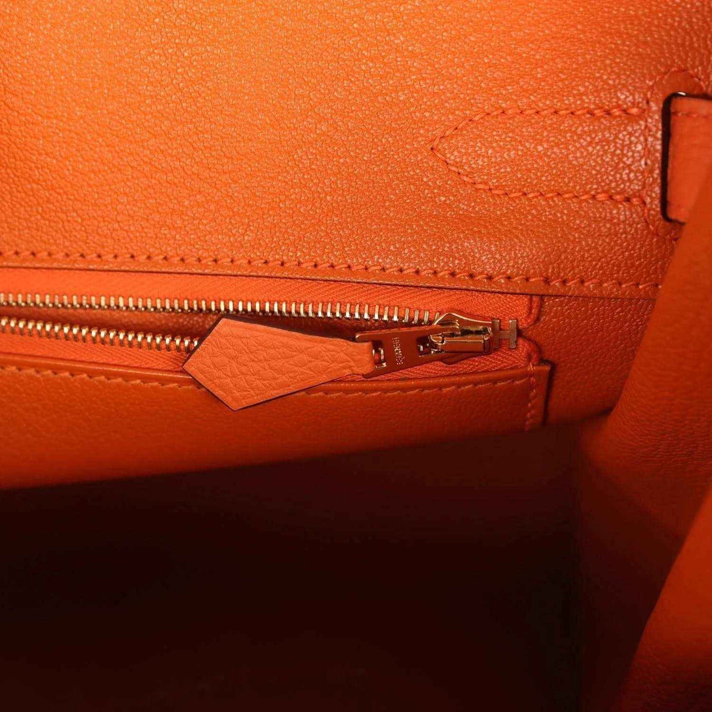 Hermes Birkin 30 orange leather interior pocket with gold zipper pull and stitching