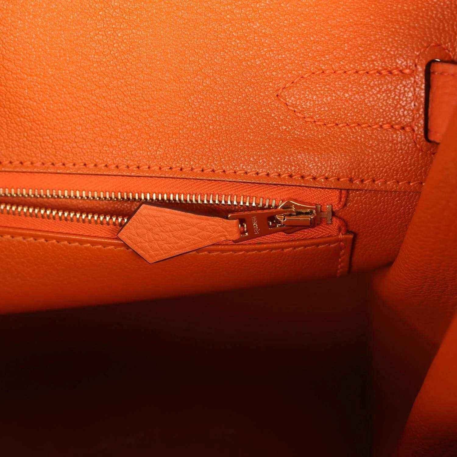 Hermes Birkin 30 orange leather interior pocket with gold zipper pull and stitching