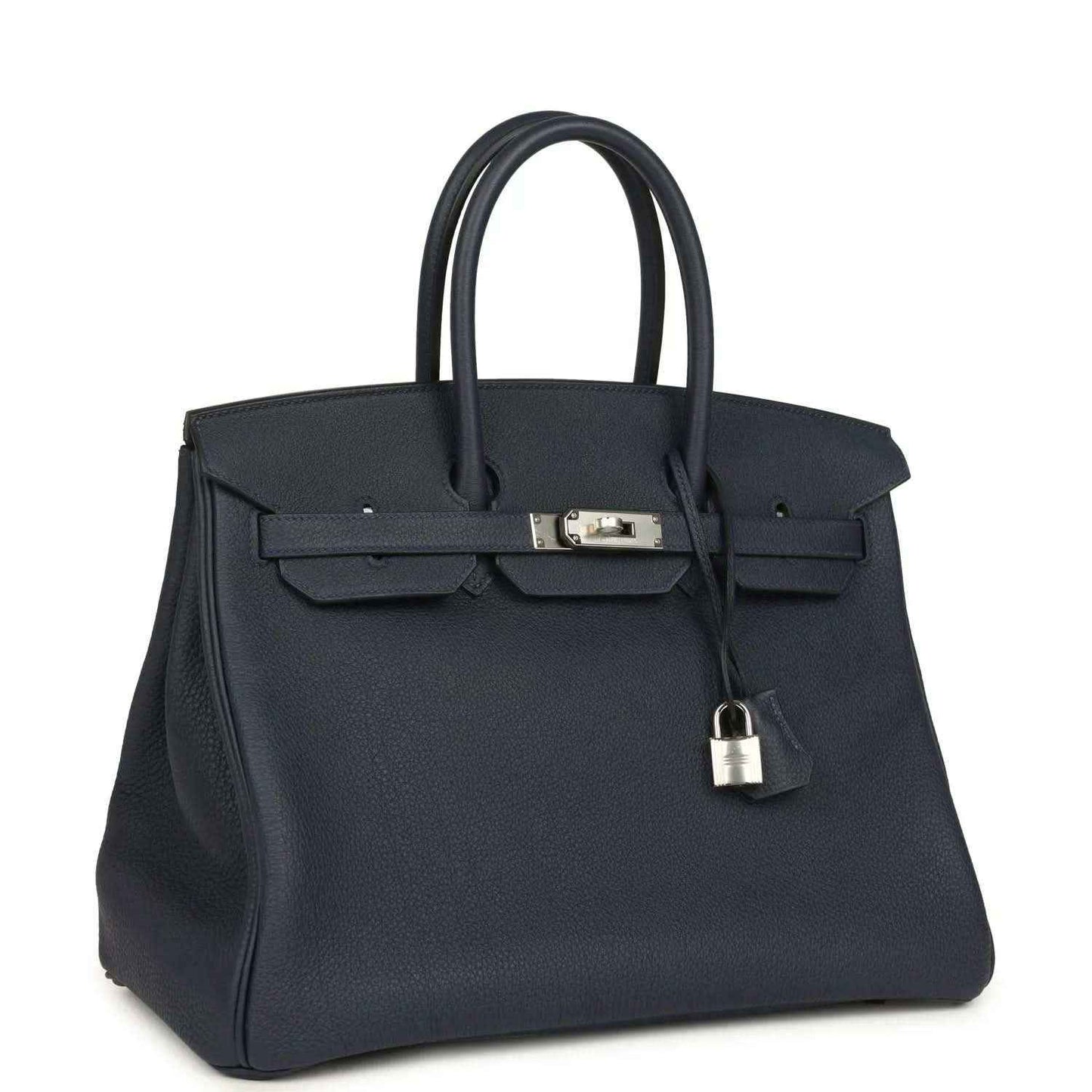 Navy leather handbag with front flap, top handles, and hanging padlock