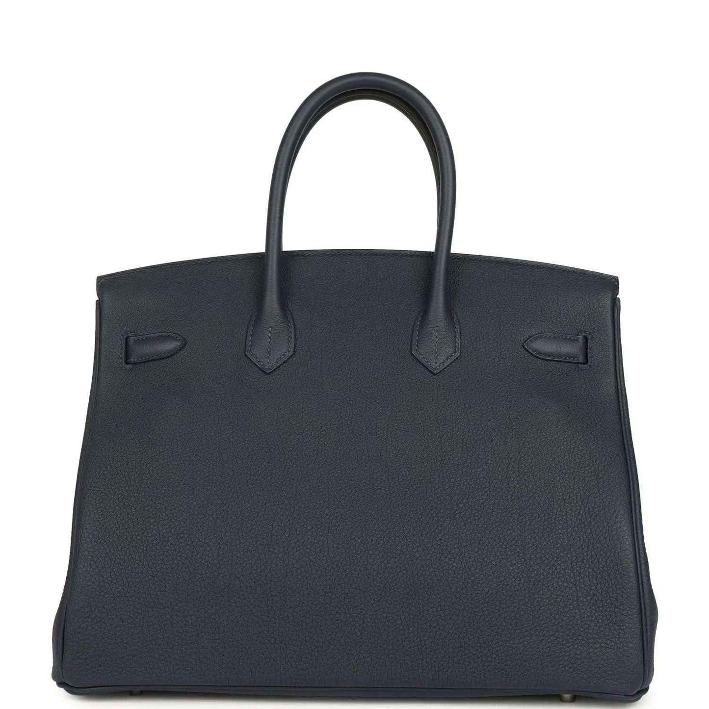 Navy leather handbag with top handles and front flap detail