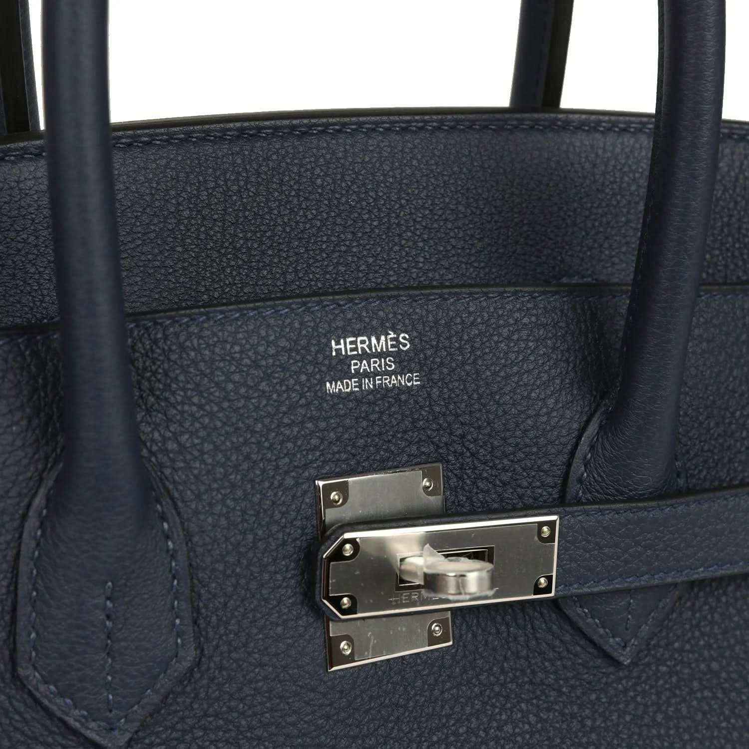 Navy leather handbag with Hermes Paris stamp and palladium-toned front clasp