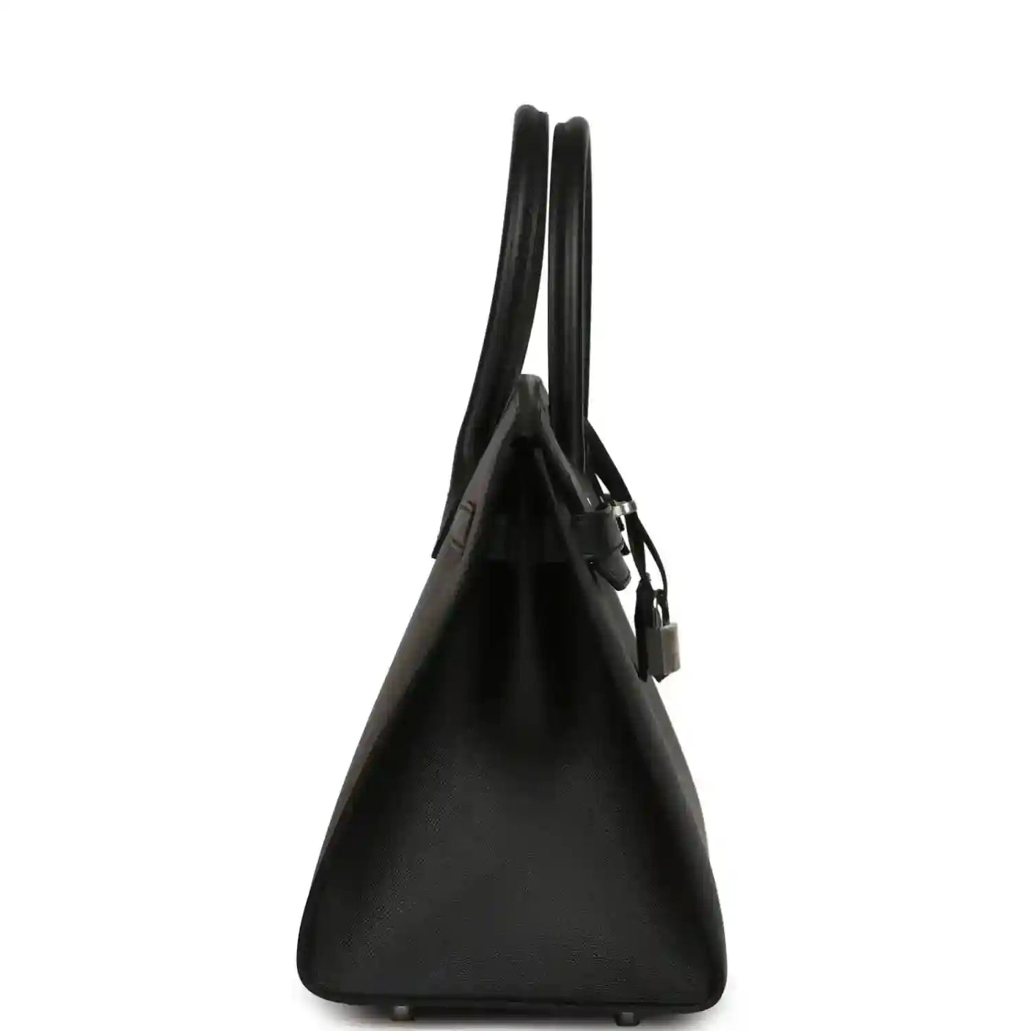 Black leather handbag from the side view with top handles and hanging lock