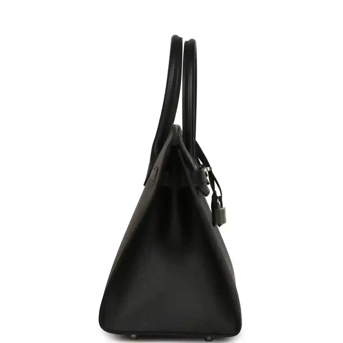 Black leather handbag from the side view with top handles and hanging lock