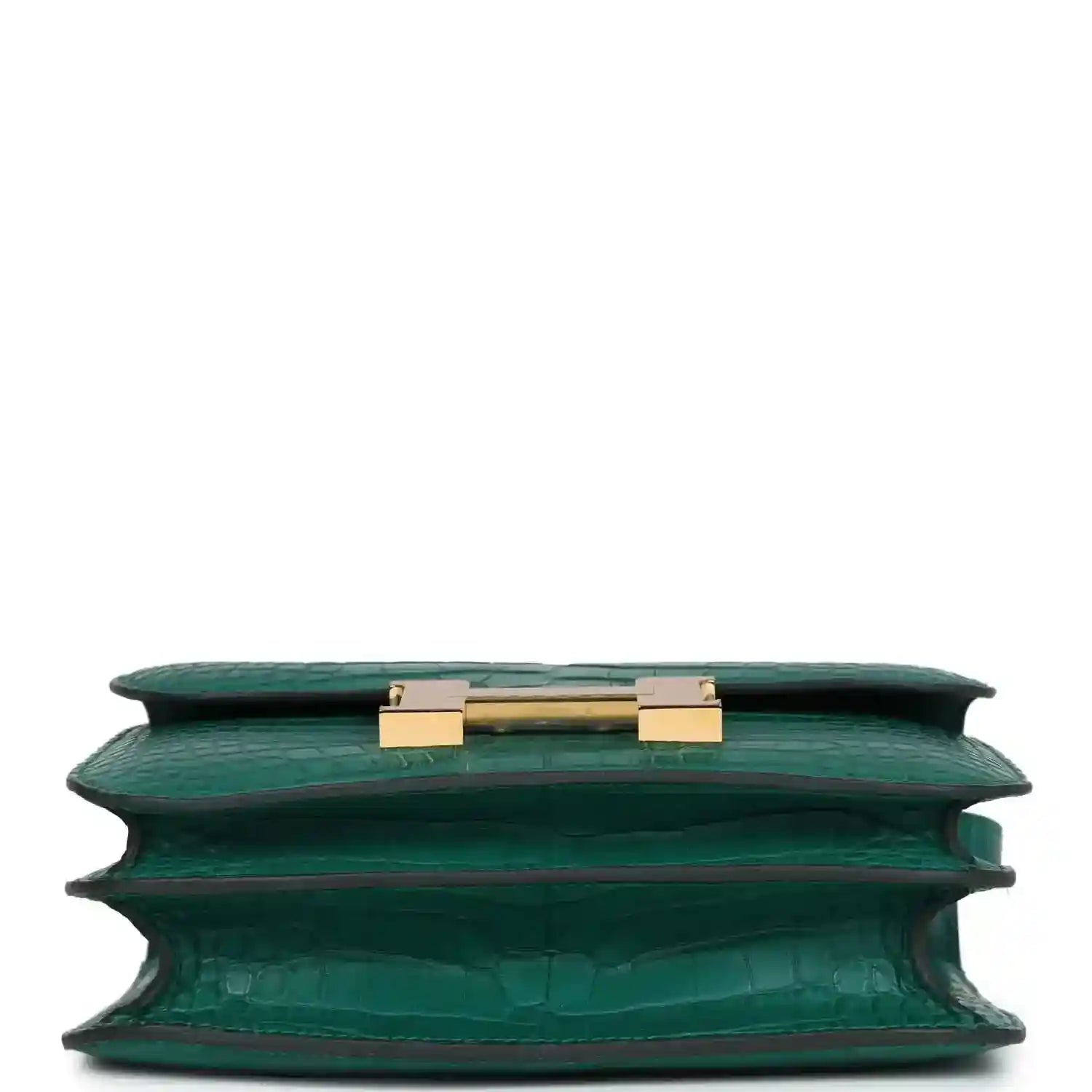 Green alligator-texture handbag top view with open flap and gold turn-lock hardware