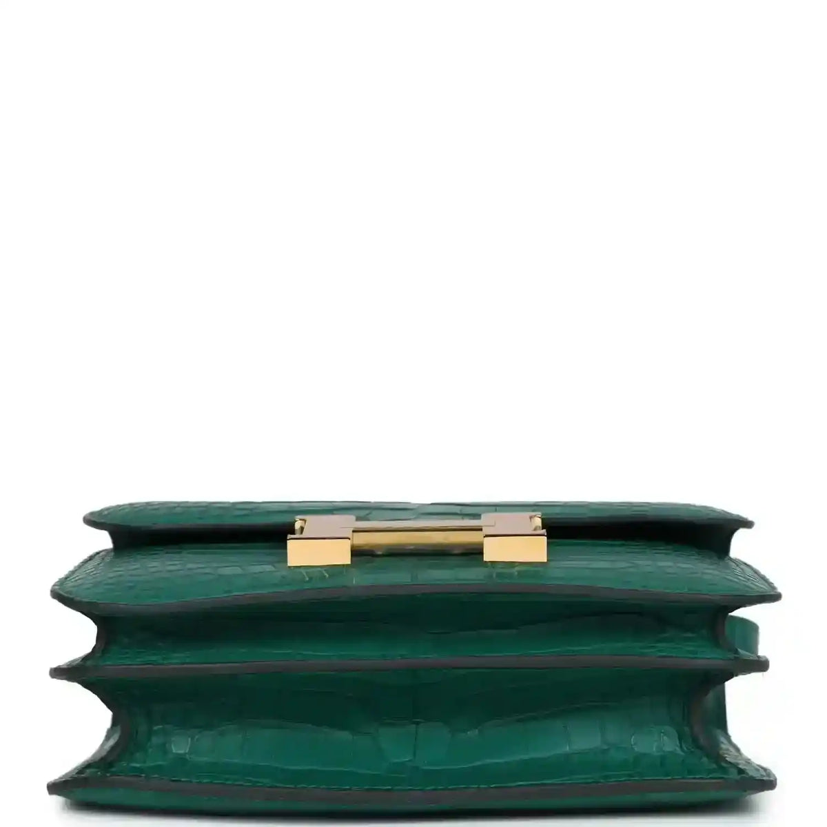 Green alligator-texture handbag top view with open flap and gold turn-lock hardware